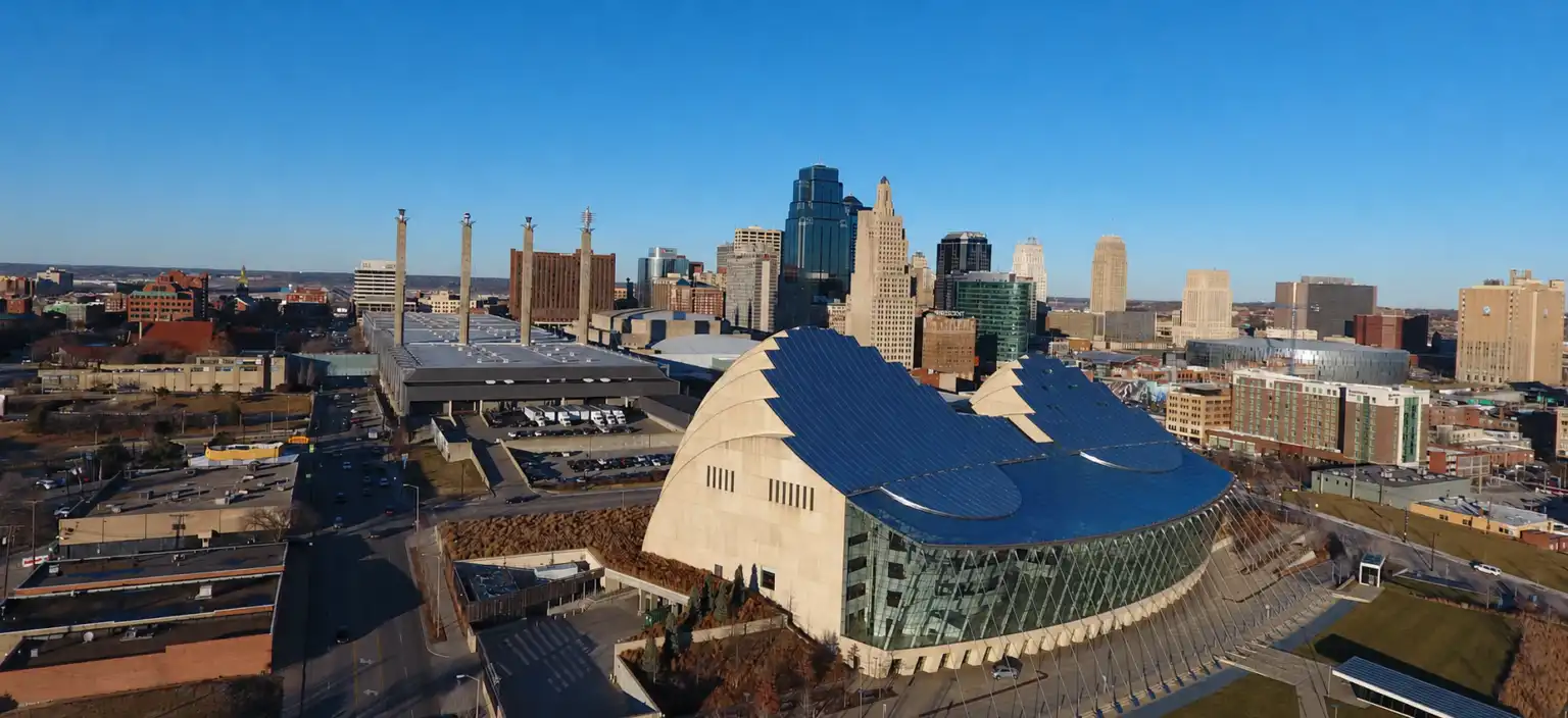Aerial view of the downtown Kansas City skyline with the Kauffman Center for the Performing Arts in the foreground