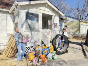 Alpine Property Management team donating dog and cat food to Chain of Hope in Kansas City